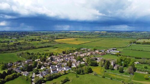 Rain Clouds Approaching A Cotswold Village